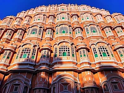 The pink honeycomb facade of Hawa Mahal in Jaipur on the Golden Triangle route