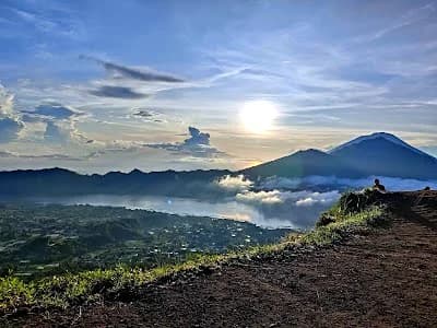 Mount Batur volcano at sunrise viewed from Bali, iconic stop on any bali itinerary