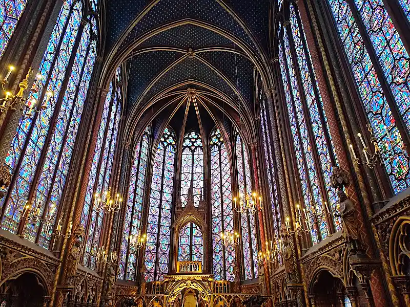 Stained glass windows inside Sainte-Chapelle in central Paris lit from outside