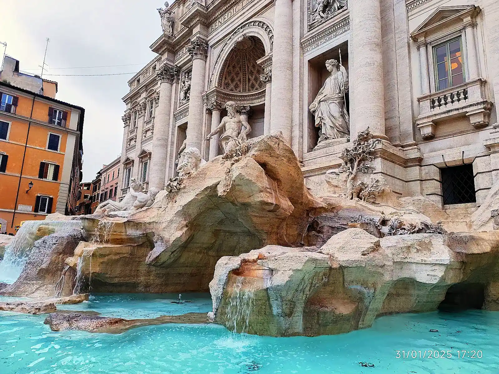 Crowds gathered at Rome's Trevi Fountain, now under capped entry rules