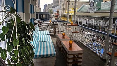 budget backpacker accommodation common area where travellers plan and compare travel costs