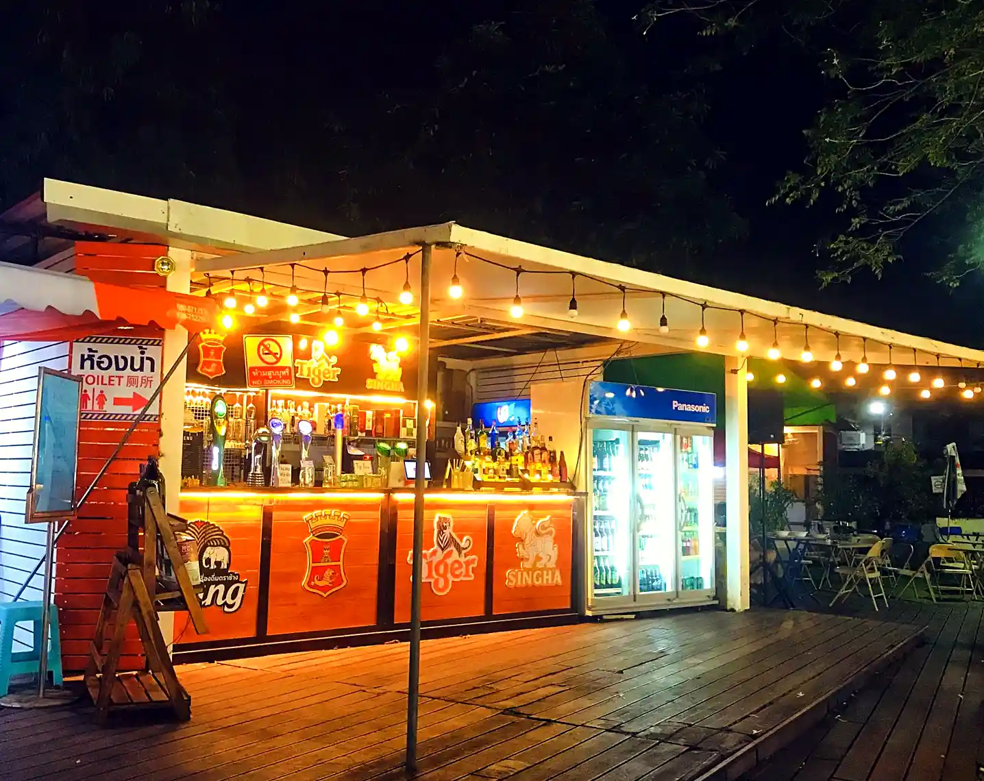 night bazaar stalls in Chiang Mai Thailand offering affordable street food and local goods