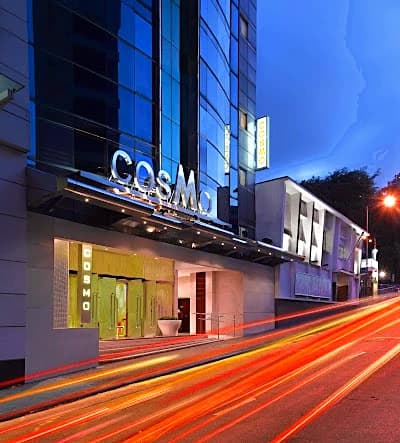 City hotel exterior with reception and daily service, the kind that suits short solo stays