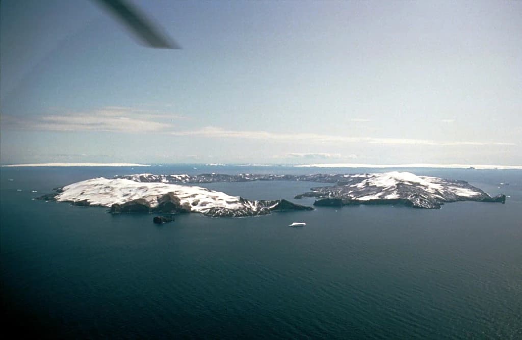Volcanic caldera and dark sand beach at Deception Island in Antarctica
