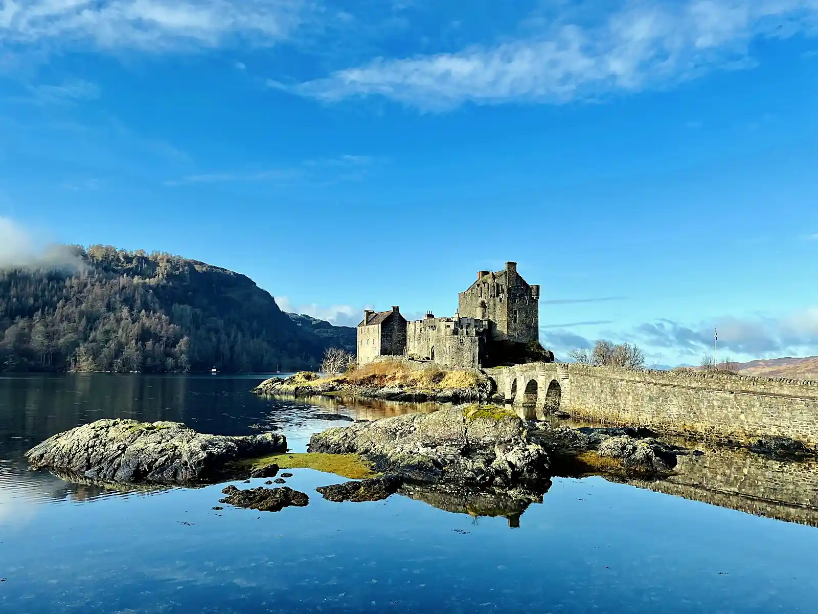 Eilean Donan Castle at dusk, a highlight on any offbeat Scotland Highlands guide route
