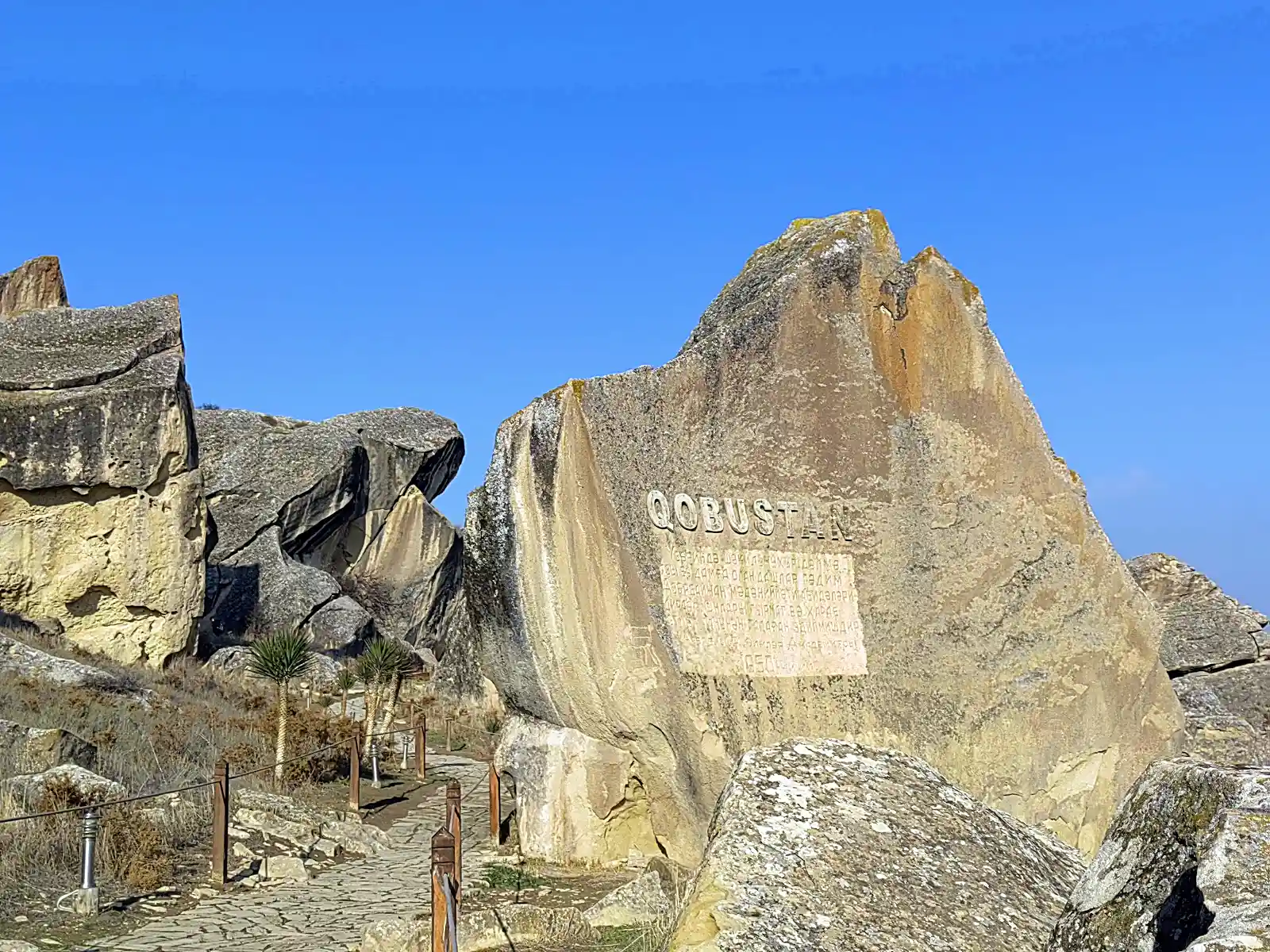 Ancient rock petroglyphs and rugged terrain at Gobustan National Park near Baku, Azerbaijan