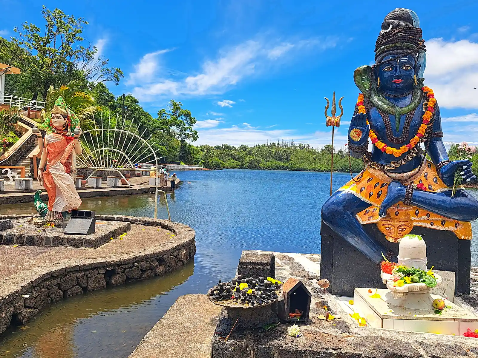 Grand Bassin sacred crater lake in Mauritius with temples along the water's edge