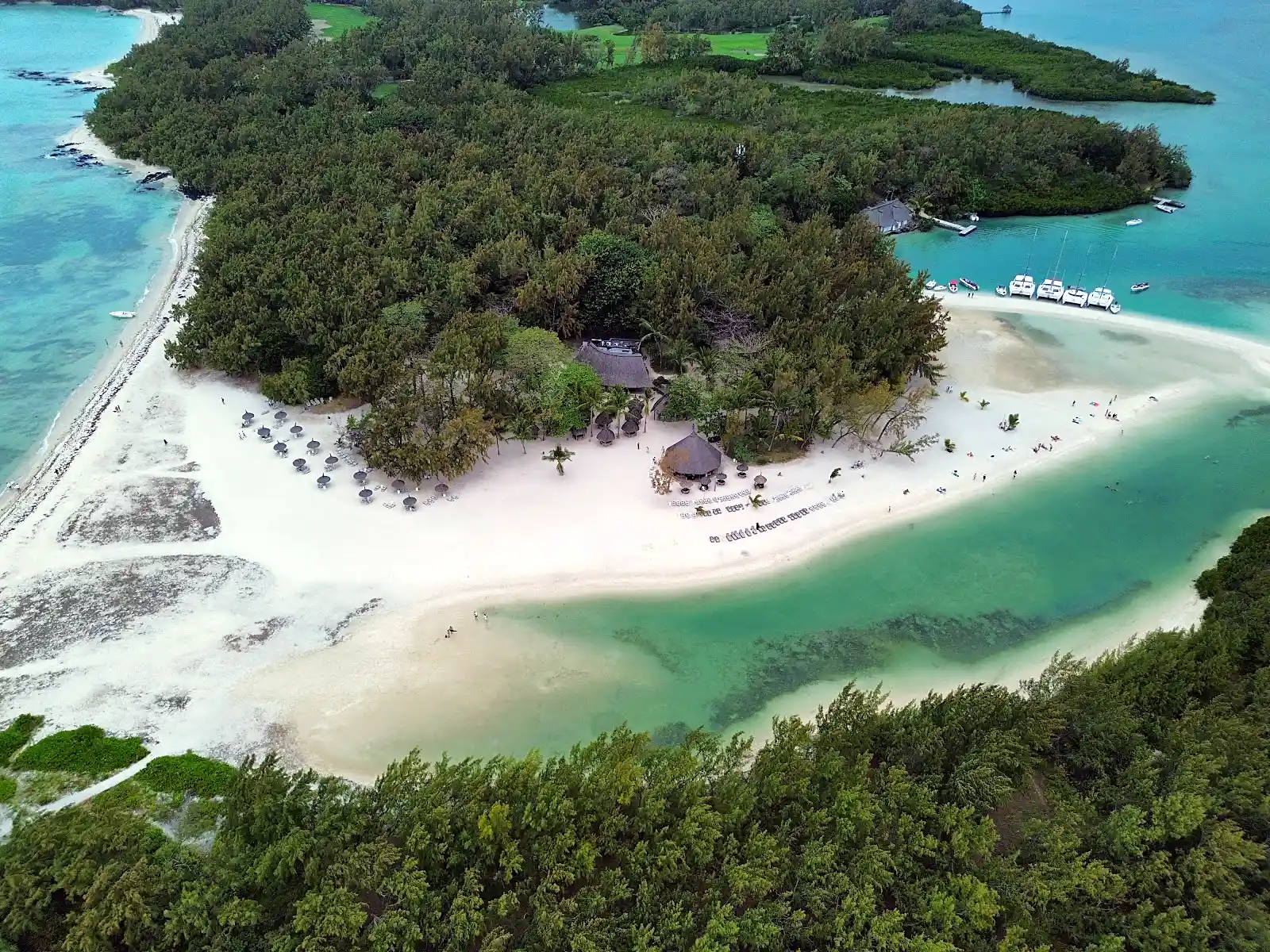 Aerial view of Ile aux Cerfs, a private island off the east coast of Mauritius surrounded by turquoise lagoon waters