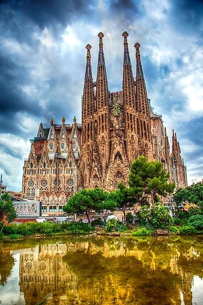 La Sagrada Família cathedral in Barcelona Spain gleaming under clear blue sky