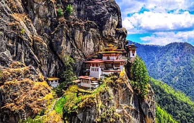 Tiger's Nest monastery clinging to Bhutan cliffs on a clear mountain day