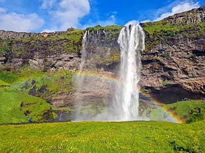 Seljalandsfoss waterfall with the walkway behind it, thirty minutes from Skogafoss on the South Coast