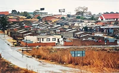 Colourful houses and street life along Vilakazi Street in Soweto, South Africa