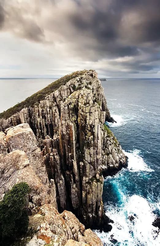 Tasman Peninsula cliffs in Tasmania, a region unaffected by which arrival card version you happen to get