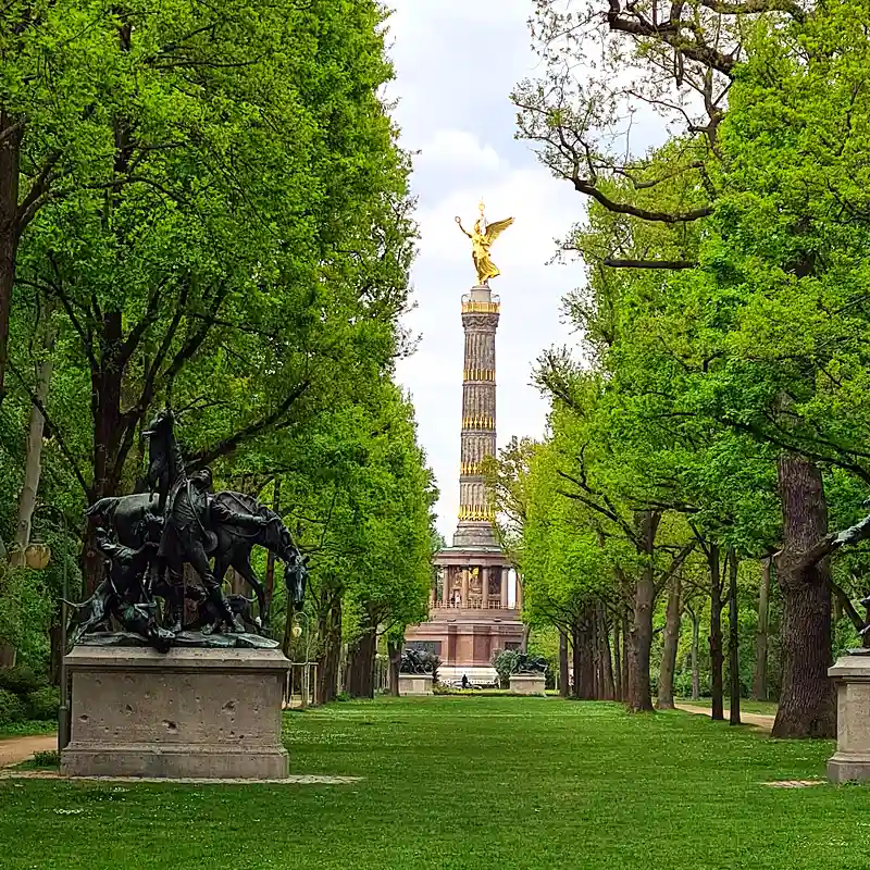 Quiet pathway through Tiergarten park in Berlin in early morning light