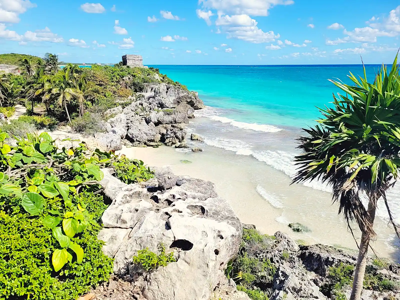 Tulum ruins on a clifftop above the Caribbean, a stop on a mexico itinerary through the Yucatan